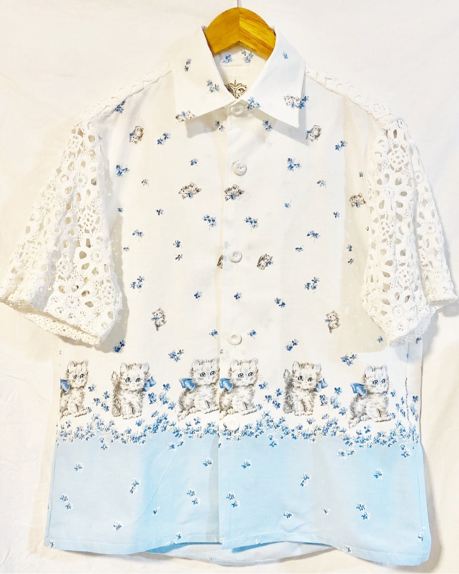 Shirt  with grey kitten and blue floral print on white cotton poplin With white crocheted sleeves and back yoke