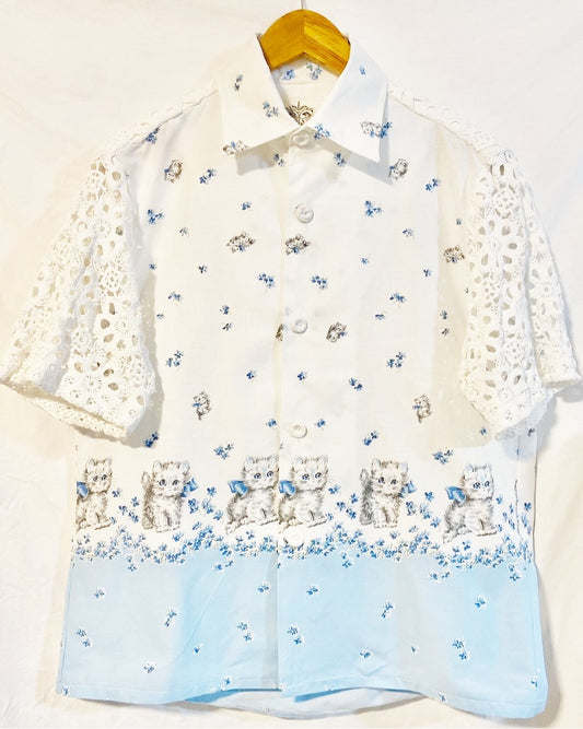 Shirt  with grey kitten and blue floral print on white cotton poplin With white crocheted sleeves and back yoke
