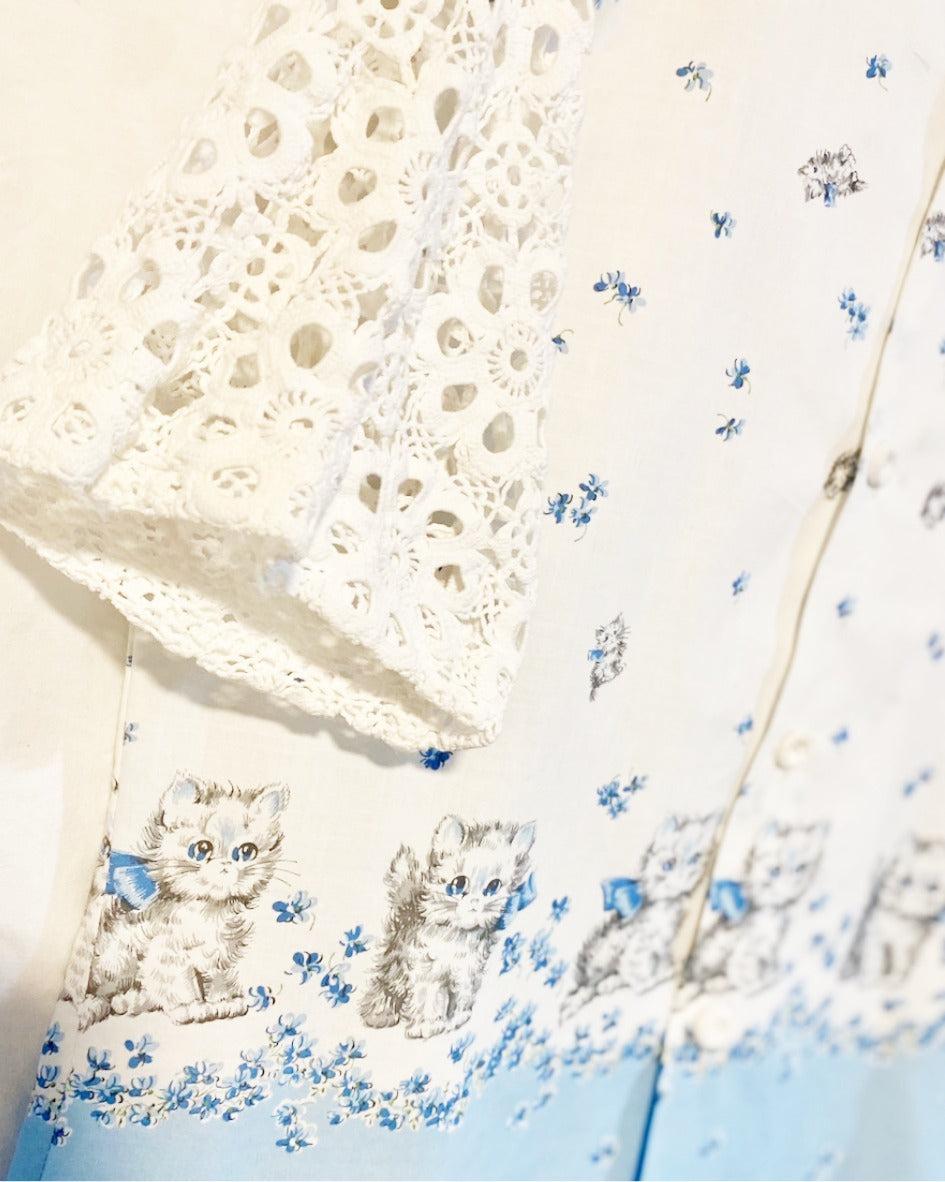 Shirt  with grey kitten and blue floral print on white cotton poplin With white crocheted sleeves and back yoke